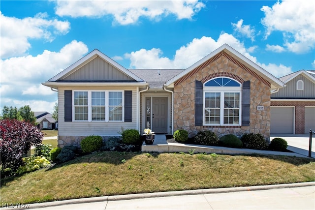 single story home featuring driveway, stone siding, an attached garage, a front lawn, and board and batten siding