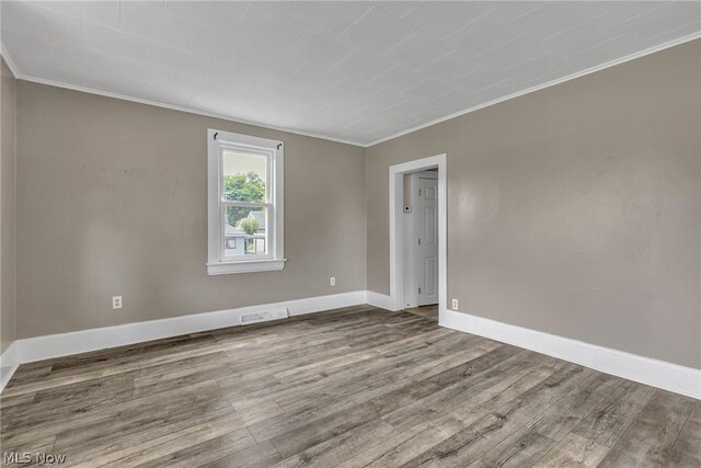 empty room featuring wood-type flooring