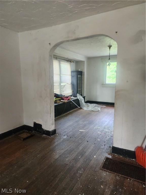 empty room with hardwood / wood-style floors