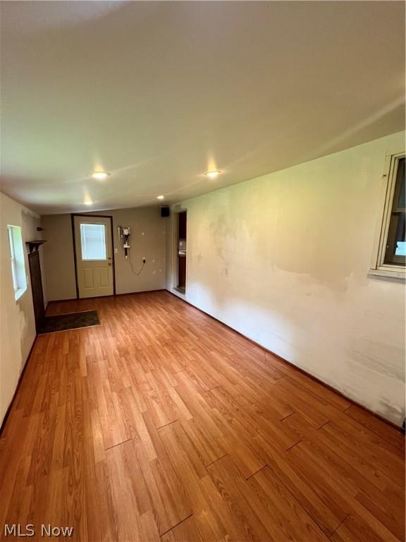 unfurnished room with light hardwood / wood-style floors