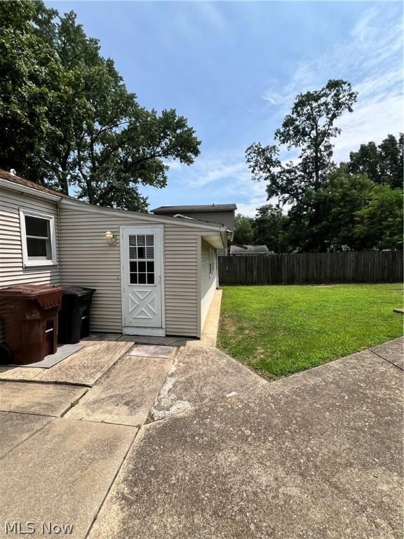 view of outbuilding featuring a yard