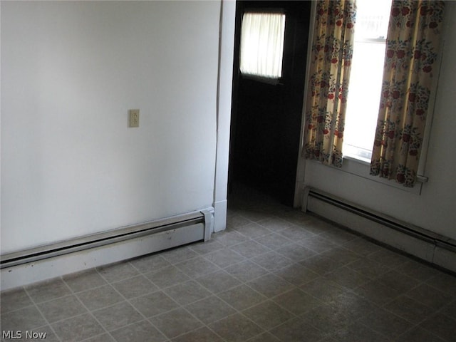 entrance foyer featuring a baseboard heating unit