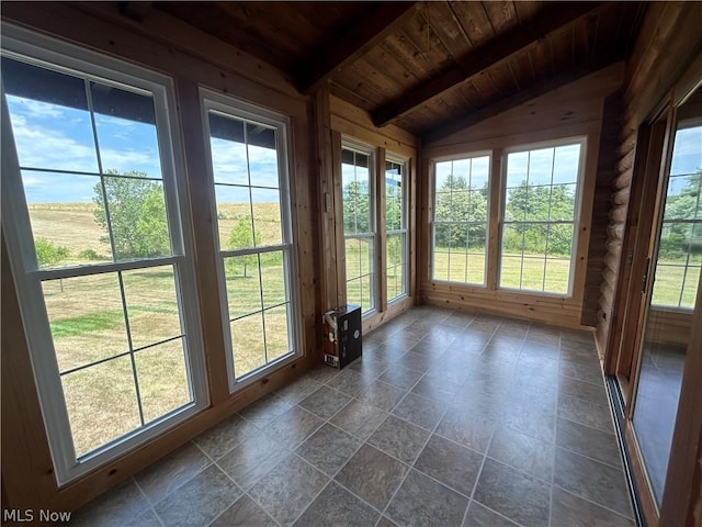 unfurnished sunroom featuring lofted ceiling with beams and wooden ceiling