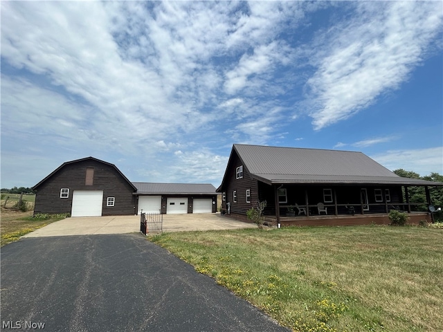 view of front of home featuring covered porch and a front yard