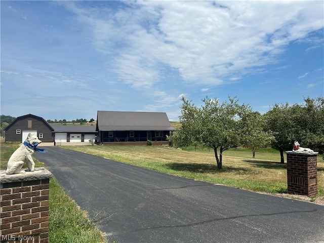 view of street with aphalt driveway