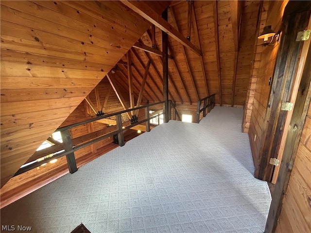 attic featuring an upstairs landing