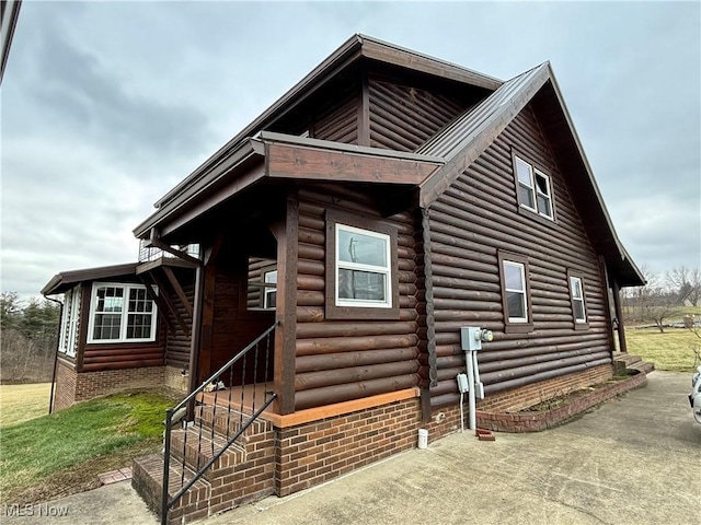 log cabin featuring log siding