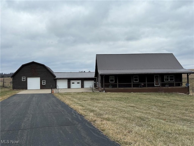 view of front of house with a garage and a front yard