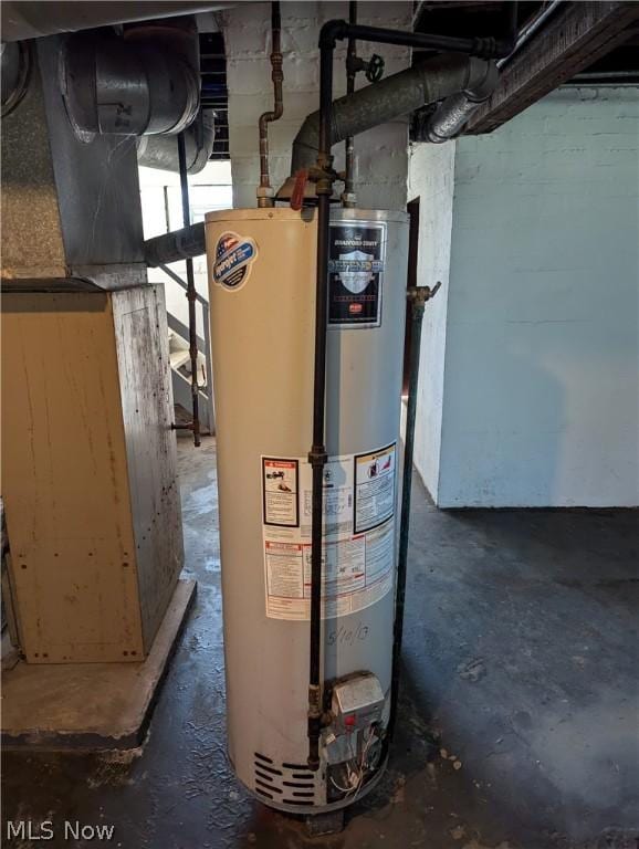 utility room with gas water heater