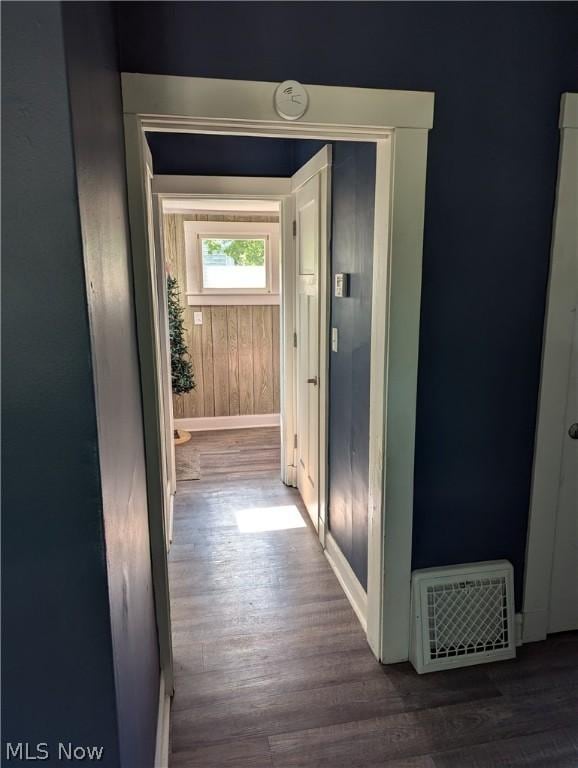 hallway with dark hardwood / wood-style flooring