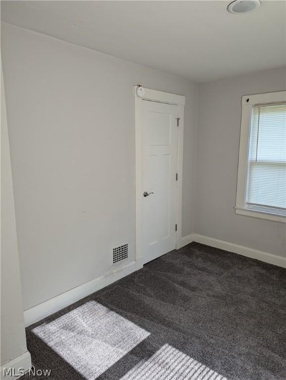 view of carpeted spare room