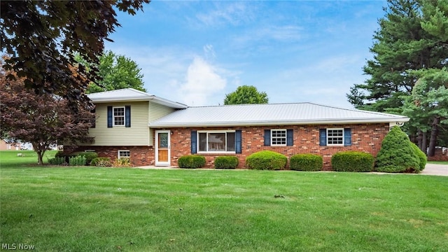 tri-level home with a front lawn