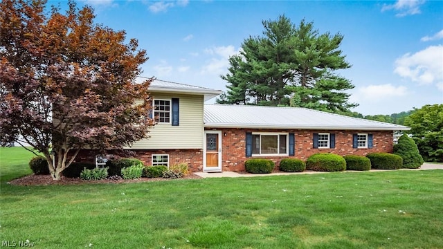 split level home with a front yard