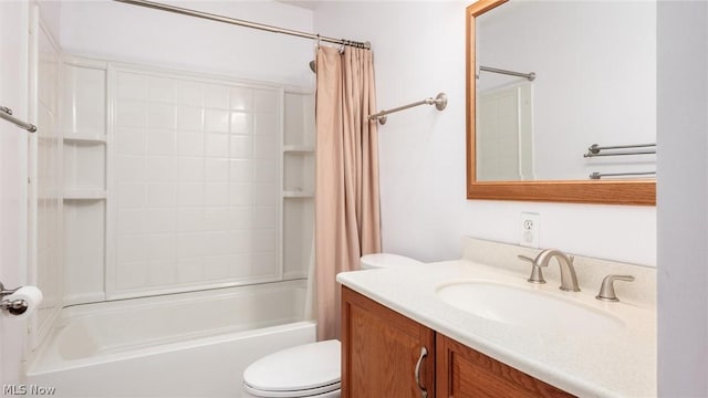 full bathroom with vanity, shower / bath combo, and toilet