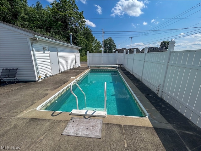 view of pool featuring a patio