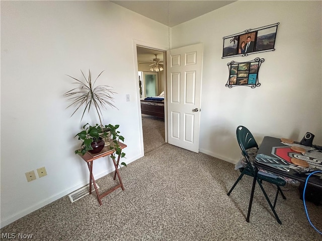 carpeted office with ceiling fan