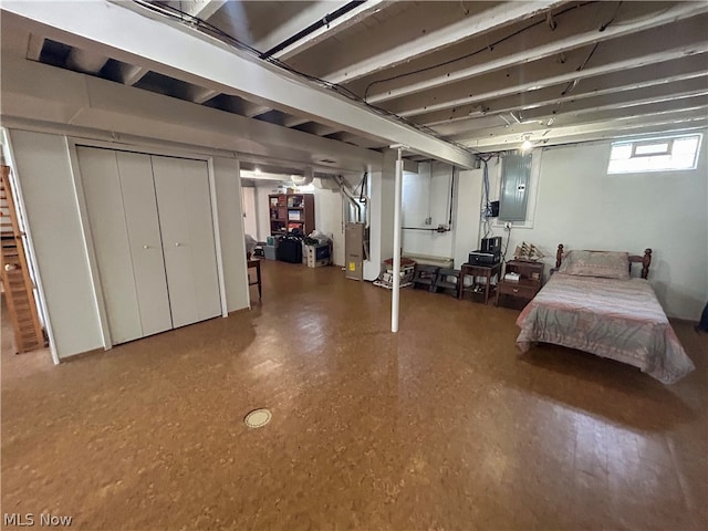 bedroom with electric panel and heating unit