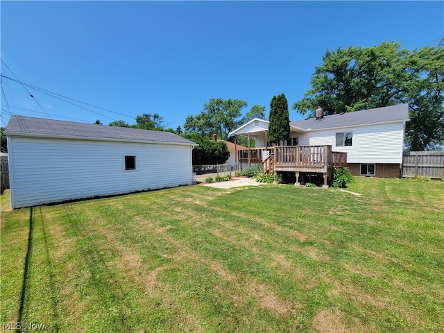 view of yard with a wooden deck