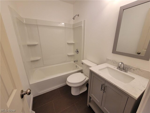 full bathroom featuring bathing tub / shower combination, tile patterned flooring, vanity, and toilet