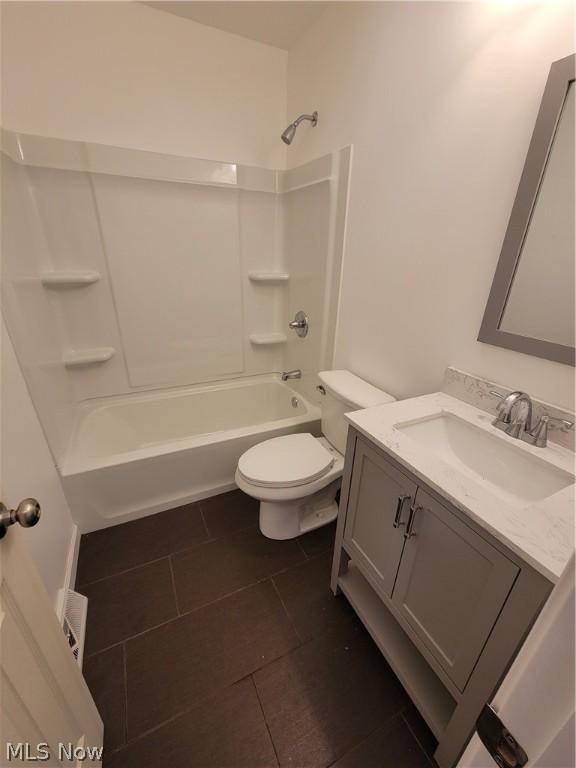 full bathroom with toilet, vanity, bathing tub / shower combination, and tile patterned flooring