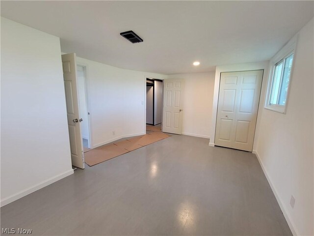 unfurnished bedroom with a closet