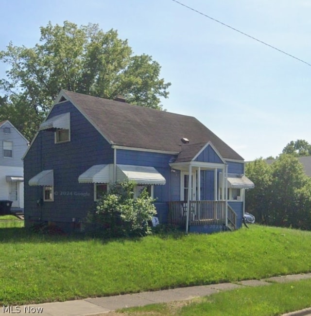 bungalow-style home with a porch and a front yard