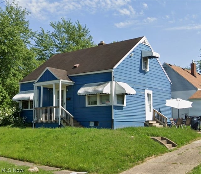 bungalow with a front lawn