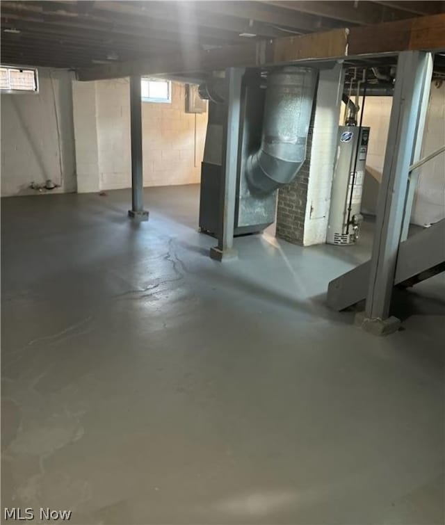 additional living space featuring vaulted ceiling, carpet flooring, and wooden walls