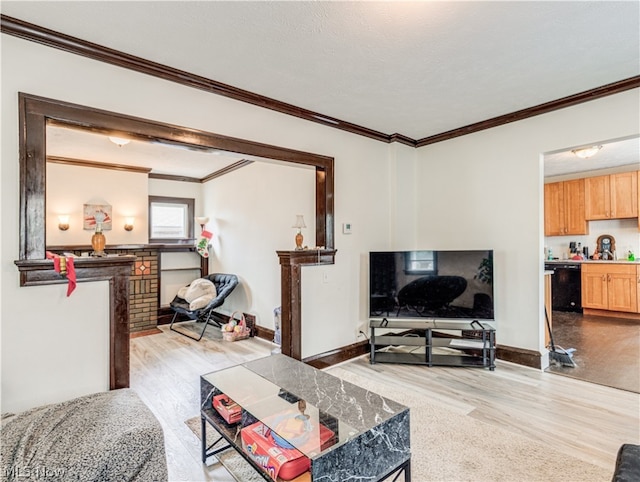 living room with light hardwood / wood-style flooring and crown molding