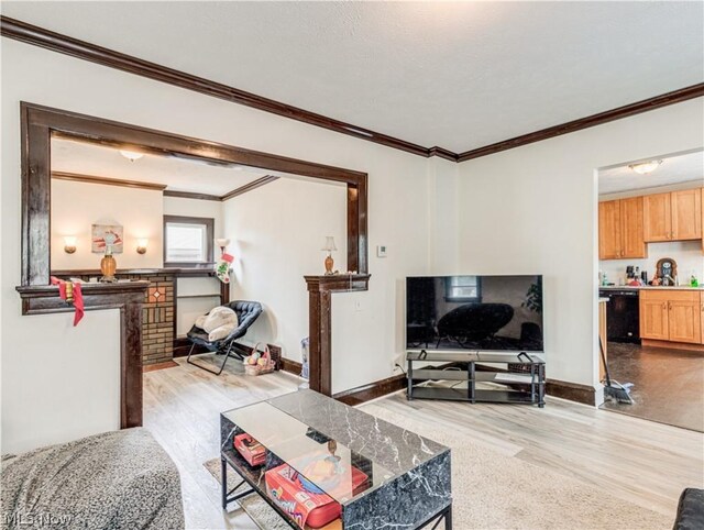 5521 W 48th St, Parma, OH 44134 - living room featuring baseboards, wood finished floors, crown molding, and a brick fireplace