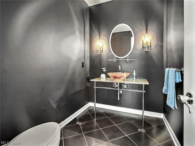 bathroom featuring tile patterned flooring, vanity, and toilet