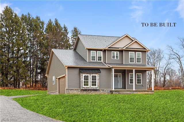 craftsman inspired home featuring a garage, a porch, and a front yard