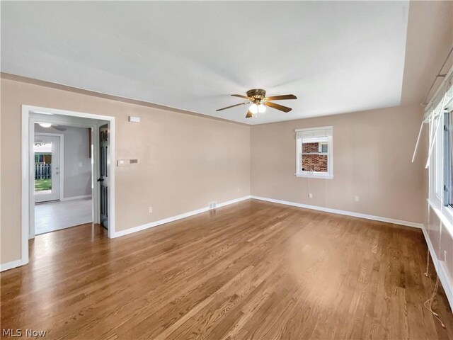 unfurnished room with wood-type flooring and ceiling fan