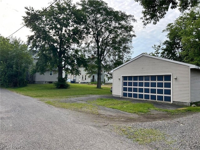 garage with a lawn