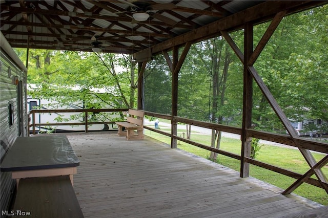 wooden terrace featuring ceiling fan