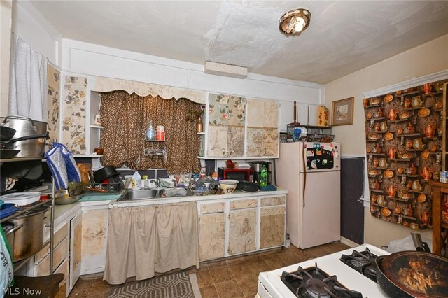 kitchen featuring sink and white appliances