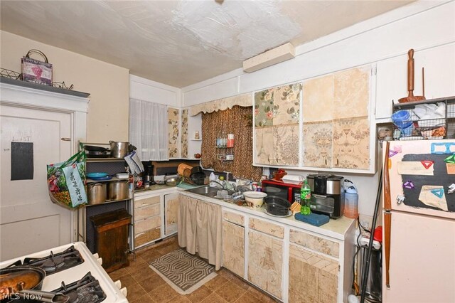 kitchen with sink and white appliances