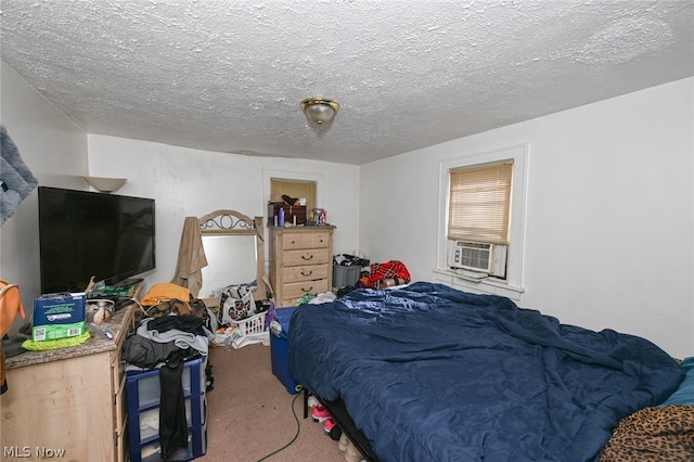 bedroom with carpet floors, a textured ceiling, and cooling unit