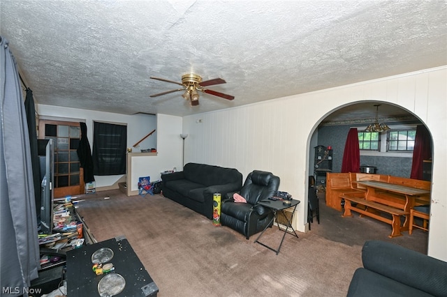 carpeted living room featuring a textured ceiling and ceiling fan