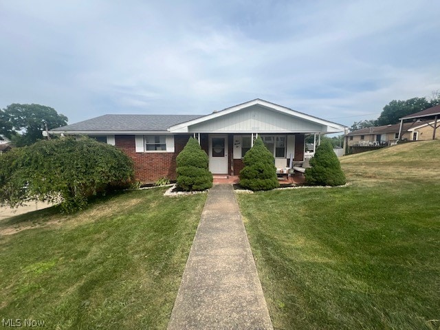 view of front facade with a porch and a front lawn