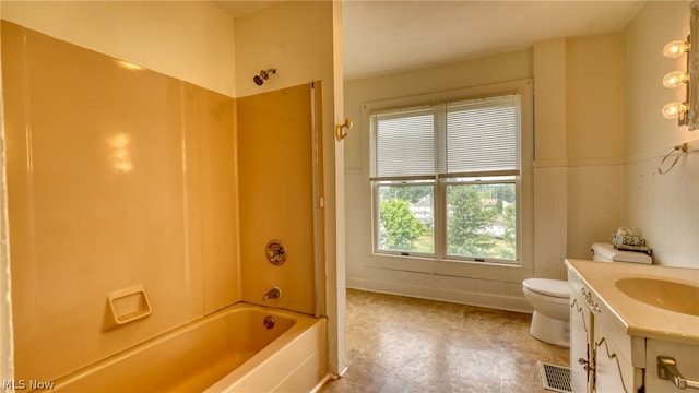 full bathroom with washtub / shower combination, toilet, and vanity