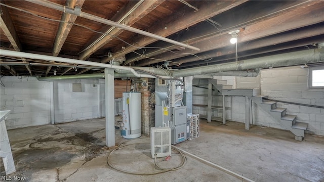 basement featuring heating unit and water heater