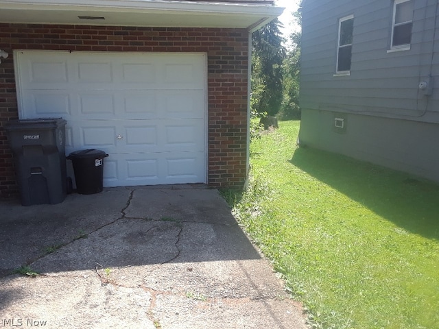 garage featuring a yard