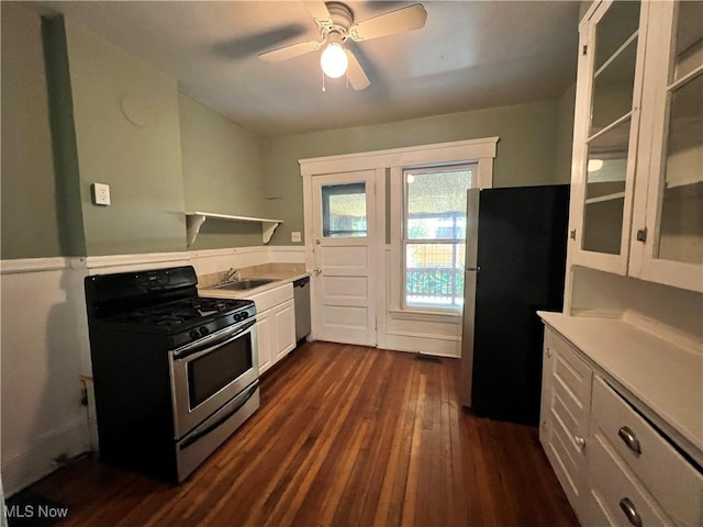 kitchen featuring white cabinetry, ceiling fan, sink, dark hardwood / wood-style flooring, and appliances with stainless steel finishes