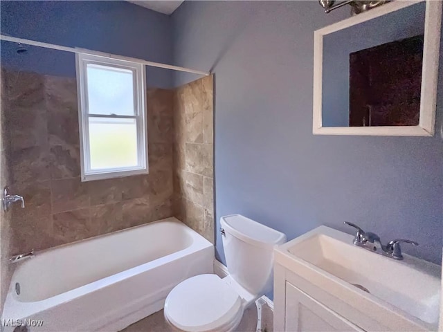 full bathroom featuring vanity, toilet, and tiled shower / bath combo