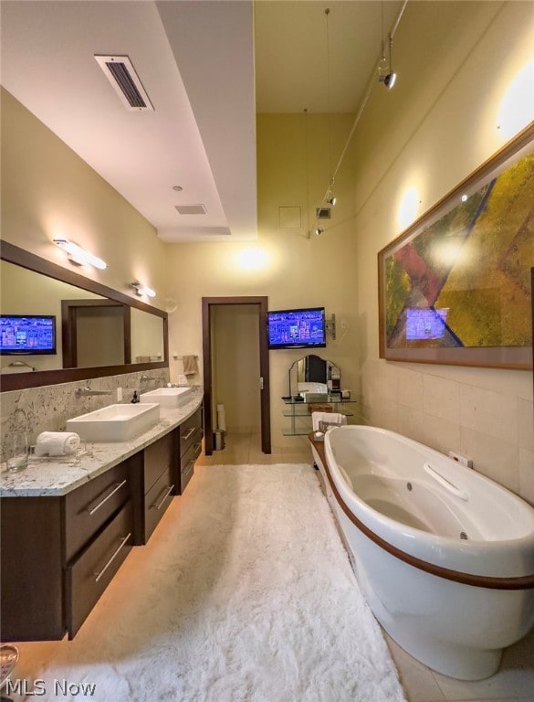 bathroom with vanity and tile patterned flooring