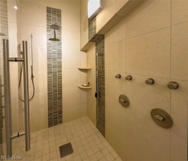 bathroom with a tile shower