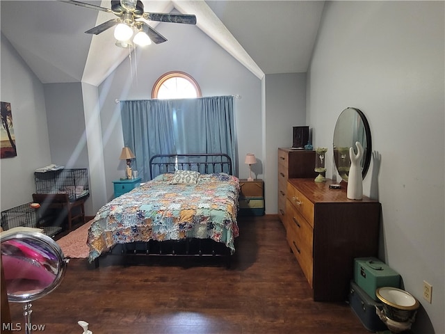 bedroom with dark wood-type flooring, vaulted ceiling, and ceiling fan