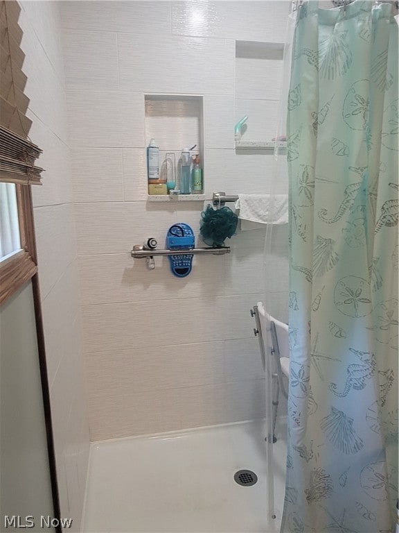 bathroom with walk in shower