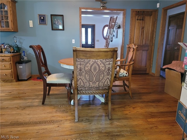 dining area with hardwood / wood-style flooring